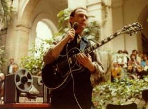 Robert Fripp speaking at a performance.