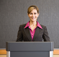 Woman Speaking at Podium