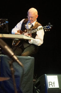Robert Fripp performing with King Crimson.