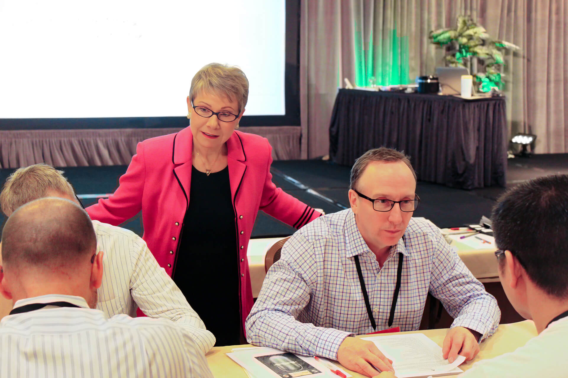 Executive Speech Coach & Creator of FrippVT, Patricia Fripp in Action Photo of Coaching with Client